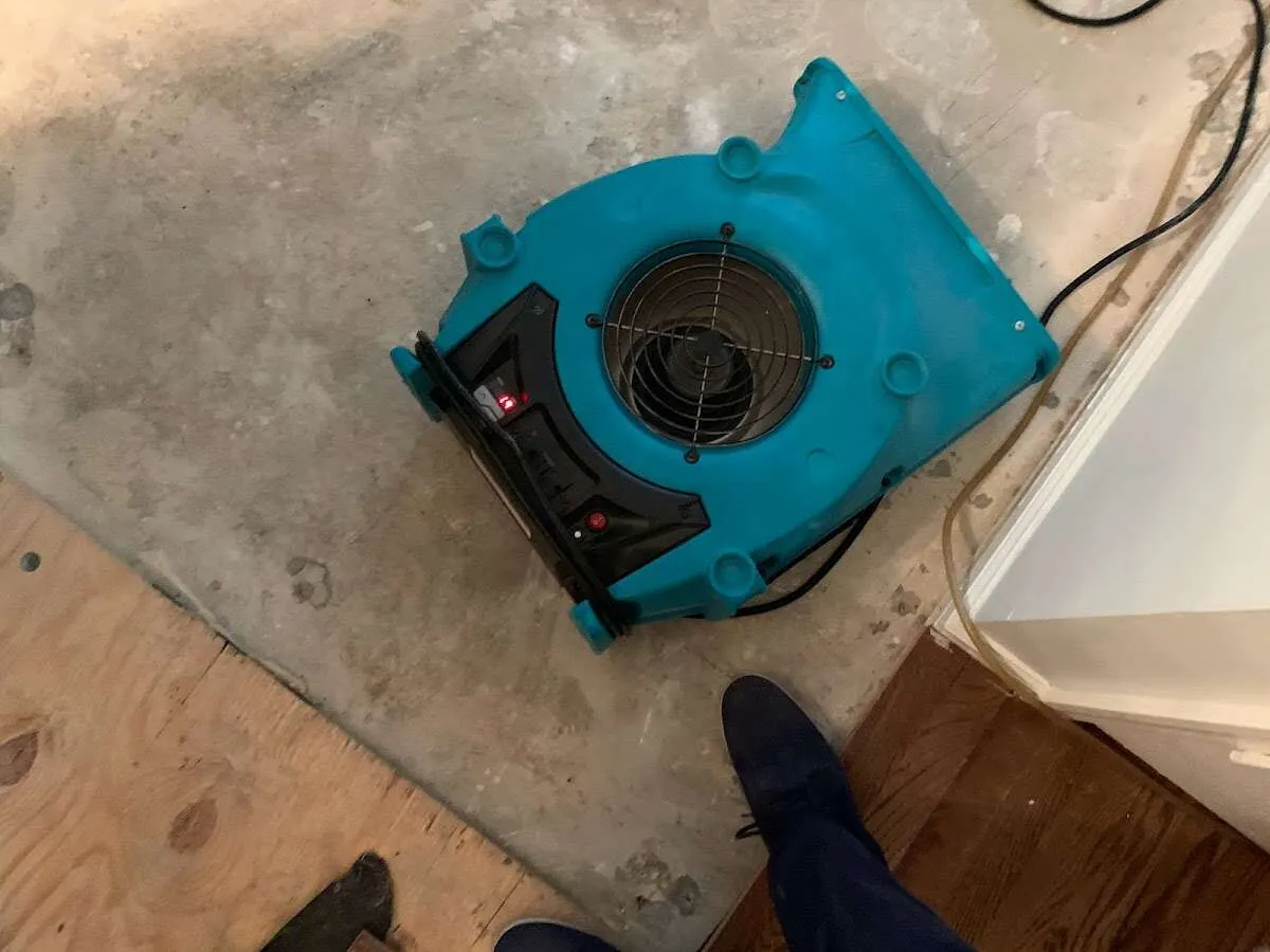 Air mover drying subfloor during Leak Detection & Repair in California City